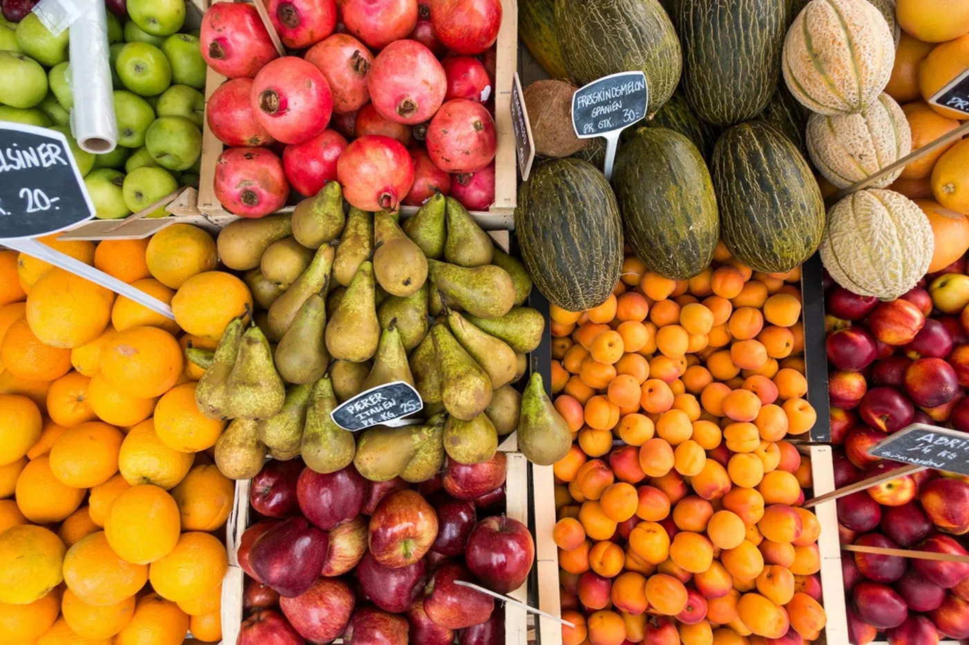 Seasonal fruit stalls at a market